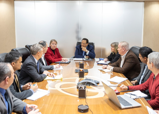 executive leadership sitting around a boardroom table